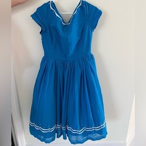 Vintage inspired beautiful blue dress with white beaded accent.